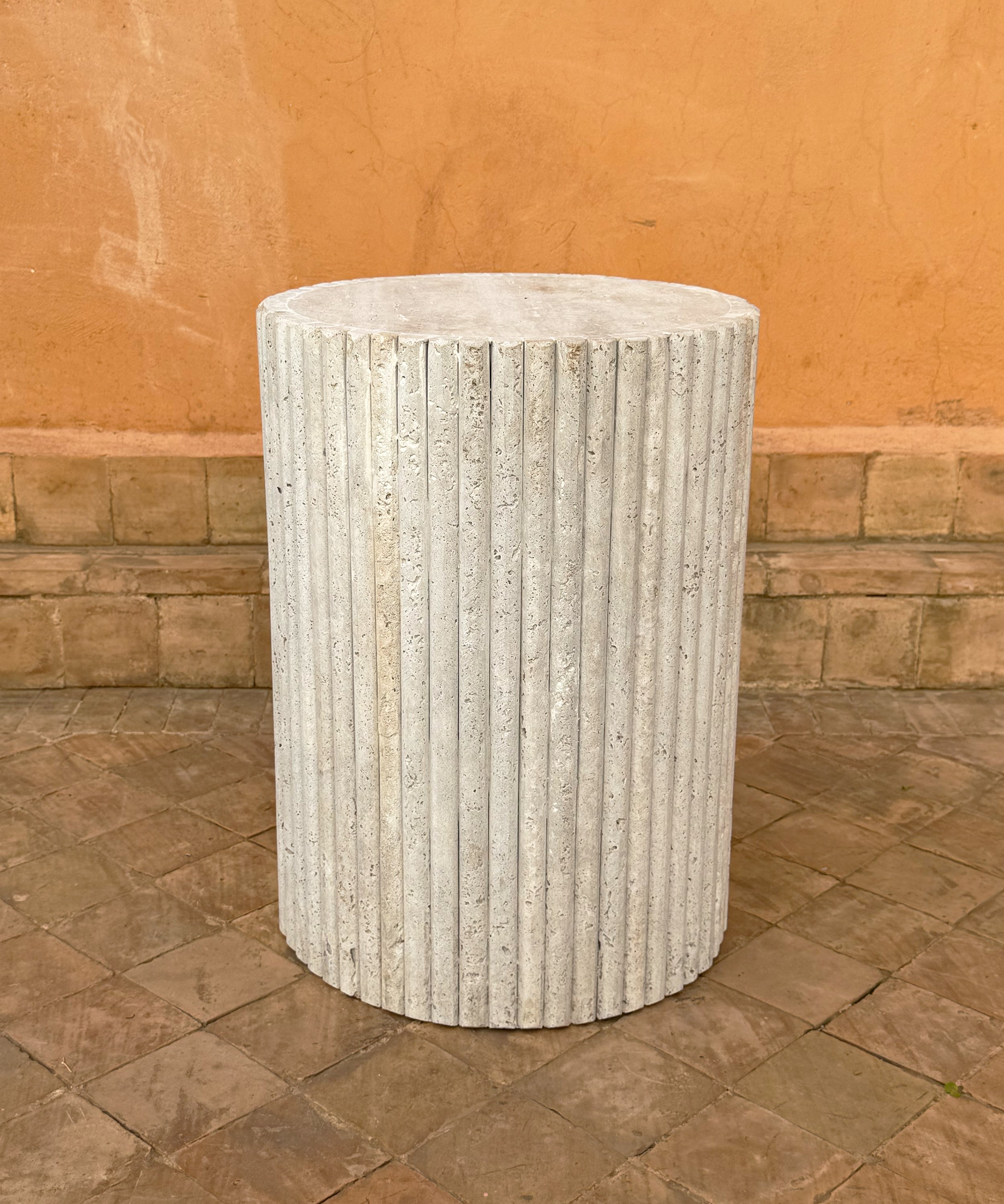 The fluted travertine side table