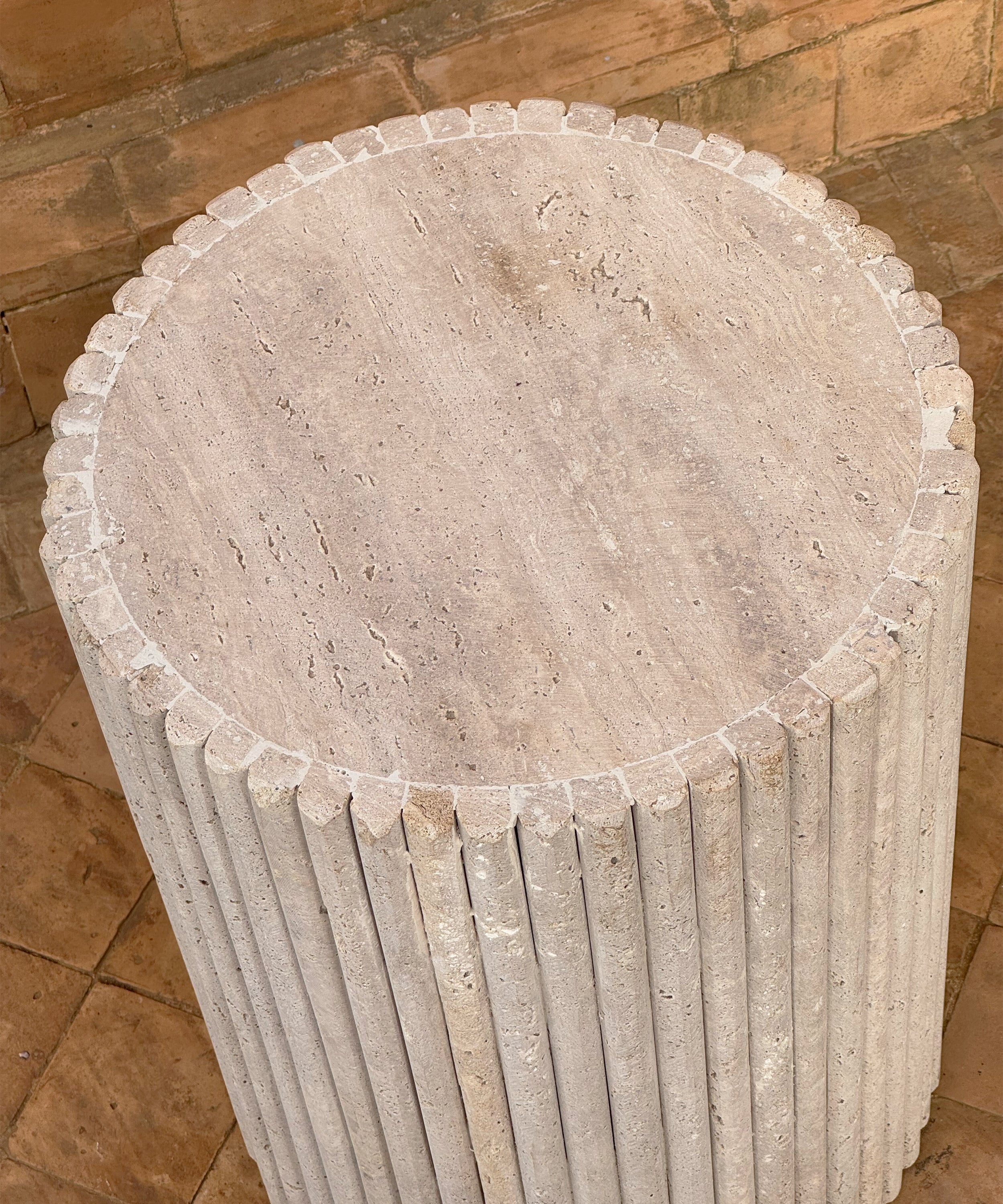 The fluted travertine side table
